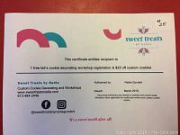 Photo of a printed gift certificate for one free kids cookie decorating workshop registration and $25 off custom cookies from Sweet Treats by Nadia.