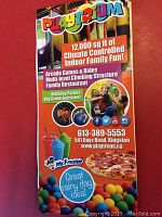 Front side of the Playtrium brochure showing features like arcade games, multi-level climbing structure, rides, family restaurant, and contact information.