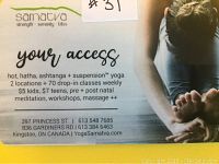 Photo of the $100 Samatva Yoga gift certificate showing yoga class types, locations, and contact info.