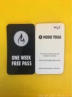 Front and back of a one-week free pass card on yellow background