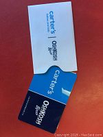 Gift card from Carters and OshKosh B'gosh showing brand logos on blue background with matching white envelope.