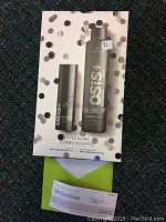 Two Schwarzkopf OSiS+ styling products on confetti-patterned backing