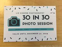 Front of printed voucher card showing Liz Cooper Photography logo, camera graphic, '30 in 30 Photo Session' text and validity date