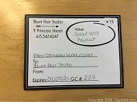 Front of gift certificate card showing salon name, address, service value, expiration date, and GC number