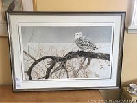 Full view of framed and matted print on tabletop