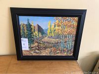 Front view of framed oil on canvas autumn landscape painting signed by artist Cameron Hay in 1974.