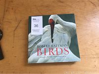 Book front cover showing the title 'Robert Bateman Birds' with an image of a white bird with red on its head.