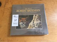 Front cover of 'The Art of Robert Bateman' hardcover book showing a painted cougar and rock scene