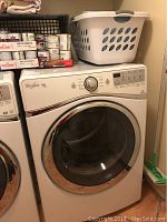 Front view of dryer with items on top