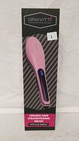 Boxed pink ceramic hair straightening brush with LCD display from Gravitti