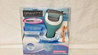Gravitti Pretty Pedi personal pedicure rolling foot file in original packaging, showing product and branding.