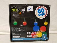Box front showing product name, technology features, and multi-colored LED globe lights images.