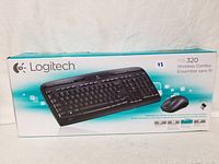 Front of Logitech MK320 wireless combo box showing keyboard image and logo