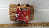 First photo showing a pack of Fatwood fire starter sticks with measurement ruler underneath for scale.
