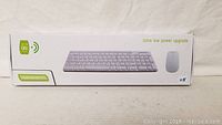 Photo of the product box showing wireless keyboard and mouse with 2.4 GHz wireless and ultra low power upgrade