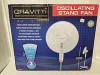 Front view of the product box showing brand Gravitti, product type Oscillating Stand Fan, and product features.
