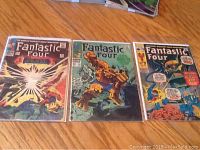 Photo of the three Fantastic Four comic books laid out side-by-side showing cover art of issues 53, 79, and 108.