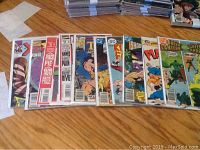 Top view of 10 comics laid out in a row showing portions of each cover