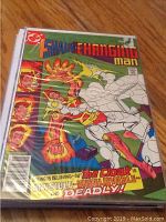 Photo of Shade the Changing Man comic book from DC Comics showing a colorful action cover with a character whose body is partially invisible.