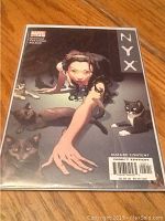 Front cover of Marvel Nyx comic book issue 5 showing female character and cats, with mature content label and price sticker.