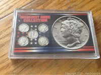 Full view of the Mercury Dime collection in a clear plastic case with American flag stars design and large Mercury dime print on right side