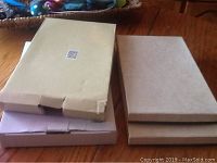 Four original boxes containing the trays, unopened or slightly opened, showing packaging and condition.