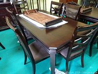 Overview of table and seven chairs grouped around table