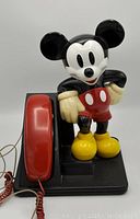 Front side of vintage Mickey Mouse telephone in good used condition.