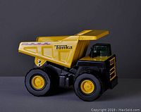 Side profile of the yellow and black Tonka dump truck showing details and size
