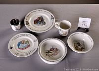 All five items arranged on table including oval plate, two smaller plates, bowl, and jam pot with metal lid showing full lot contents.