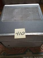 Closed view of the National RS 772N reel to reel tape recorder with a metal grille on top and a reference number sticker.