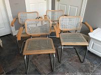 Four chairs grouped, shows overall condition and design