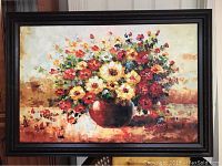 Frontal view of the floral bouquet oil painting in dark wood frame on neutral wall, showing full artwork with vibrant colors and detailed flowers.