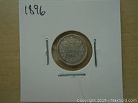 Reverse side of the 1896 Canadian silver five cents coin showing the Canadian coat of arms and denomination.