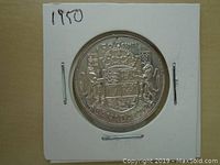 Reverse side of the 1950 Canadian fifty cents coin with detailed crowned shield and '50 CENTS CANADA 1950' inscription.