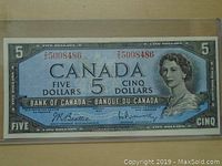 Front side of the 1954 Canadian five-dollar bank note showing portrait of Queen Elizabeth II and serial numbers