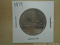 Front view of the 1979 Canadian one dollar coin showing the canoe and 'CANADA DOLLAR' text.