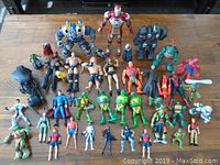 Front overview showing all 38 figures on a wooden surface, displaying wide variety of characters and sizes