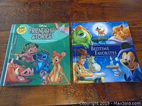 Photo of two Disney children's storybooks, Friendship Stories and Bedtime Favorites, on wooden table surface