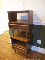 Two nightstands stacked showing front and side