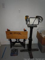 Photo showing Black & Decker Workmate 200 workbench and 5 inch bench grinder side by side