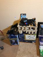 Assortment of yoke, quadrant, pedals and X-Plane manual in molded tray and boxes