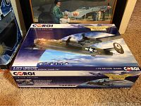 Closed box showing Corgi Aviation Archive limited edition B-24D Liberator model packaging with aircraft art and branding.