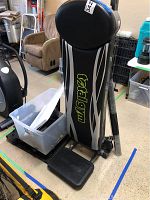 Front view of folded Total Gym bench showing branding