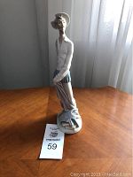 Front left side view of the porcelain Don Quixote figurine.