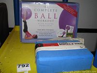 Photo showing The Complete Ball Workout box featuring Pilates principles, includes high-quality exercise ball, booklet and DVD