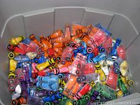 Bin full of assorted Sally Hansen Crayola Insta-Dri nail polish bottles in various colors.