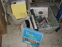 Bin with various vintage LPs and 45s showing colorful album covers including 'Popular Music That Will Live Forever'.