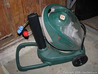 Right side view showing base, wheels, collection chamber and top handle