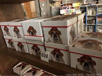 Boxes stacked with Bulldog design on sides, representing 18 boxes of Trend mugs